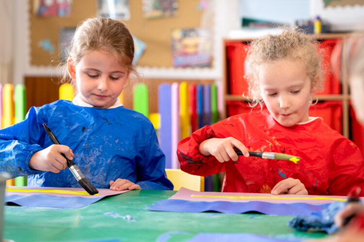 Two girls painting