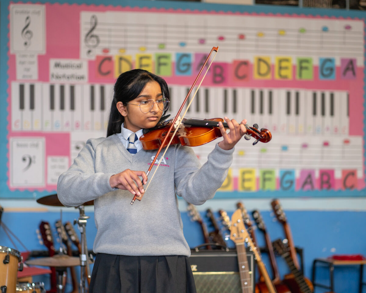 Student playing violin Shrewsbury Academy | Marches Academy Trust