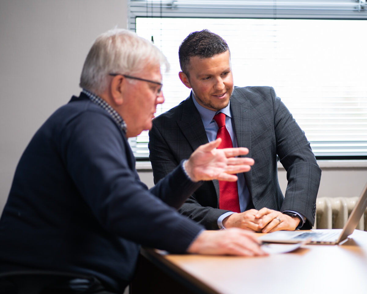 Teachers around laptop Shrewsbury Academy | Marches Academy Trust