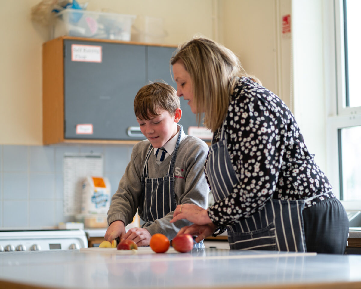 Student and Teacher Cooking Shrewsbury Academy | Marches Academy Trust